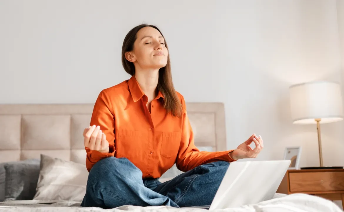 Woman sitting comfortably with eyes closed
