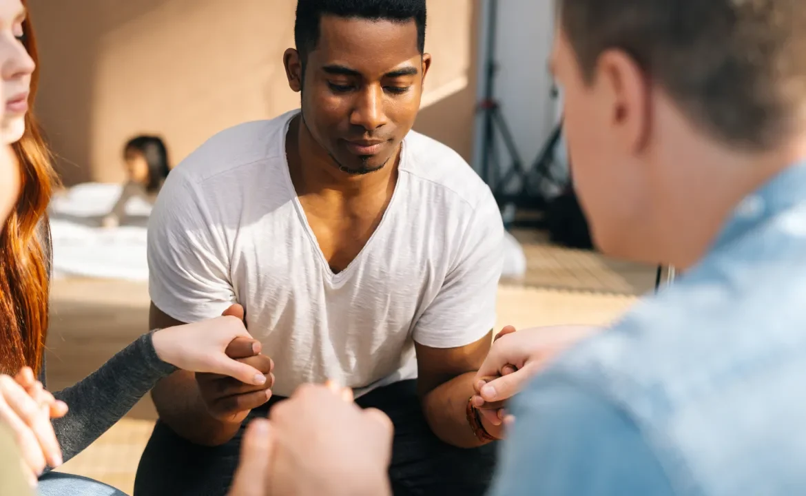 People sitting together and offering support